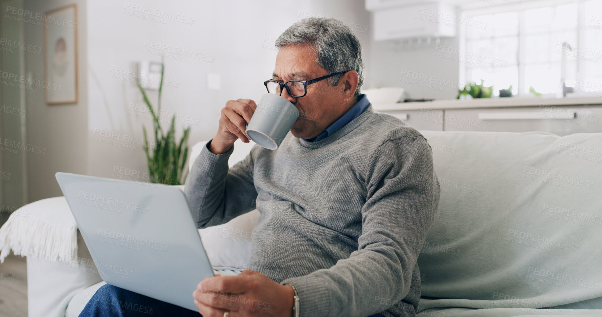 Buy stock photo Drinking, coffee and old man with laptop, home and watching movies with subscription and retirement. Online, entertainment and senior person with tech for film, relax and break with tea in house