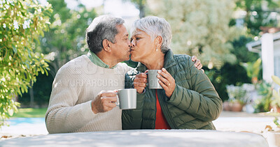 Buy stock photo Backyard, kiss and senior couple with coffee for affection, bonding and relaxing outdoor Retirement home, marriage and mature man and woman with drink for relationship, love and commitment in garden