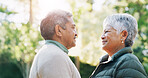 Smile, senior couple and love at park for partner care, travel date and bonding together. Happy, elderly people and outdoor fresh air for morning commute, healthy relationship and marriage commitment