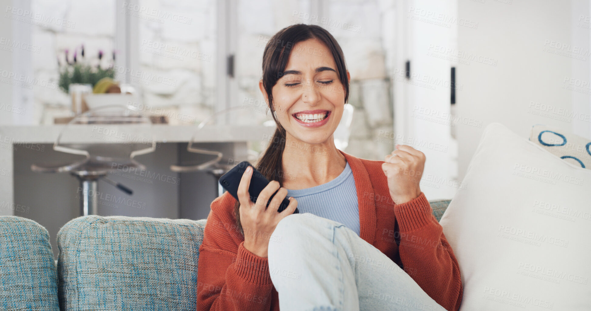 Buy stock photo Fist pump, happy and woman with phone on sofa in home with winning, prize or lottery on mobile app. Excited, celebration and female person with cellphone for online gambling in living room at house.
