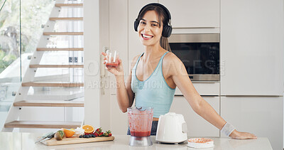Buy stock photo Portrait, smoothie and woman in kitchen, smile and fitness with wellness, nutrition and blender. Home, headphones and person with happiness, healthy drink and vegan juice with detox and protein shake