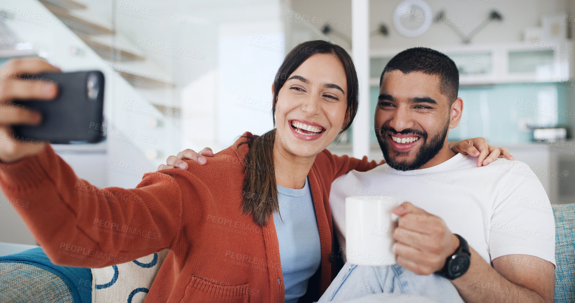 Buy stock photo Happy couple, selfie and coffee on sofa in home with hug, care or bonding for web post in lounge. Woman, man and love in living room, photography and profile picture on social network at apartment