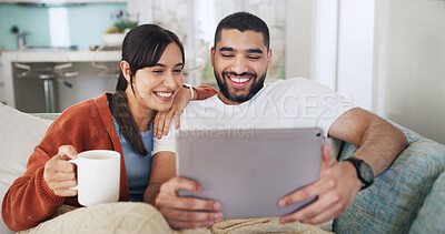 Buy stock photo Tablet, smile and couple in home for website, video and bonding on living room sofa. Coffee break, technology and happy man with woman, streaming and social media or internet browsing for film