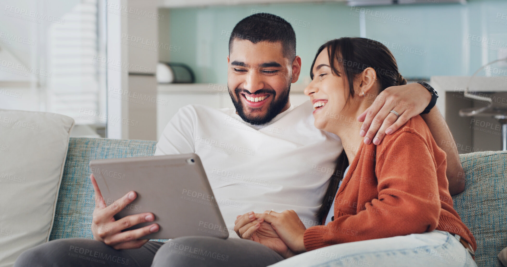 Buy stock photo Tablet, laugh and couple in home for streaming, video and bonding on living room sofa. Hug, technology and happy man with woman, website and social media joke or internet browsing for comedy film