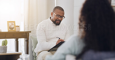 Buy stock photo Writing, therapy and discussion with man in counseling session for mental health, assessment and support. Patient report, psychologist diagnosis and treatment plan with people in office for healing