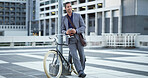 Bike, phone and thinking with businessman in city for eco friendly commute to work location. App, communication and happy employee planning route with bicycle for zero emission transportation