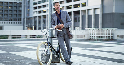 Buy stock photo Bike, phone and thinking with businessman in city for eco friendly commute to work location. App, communication and happy employee planning route with bicycle for zero emission transportation
