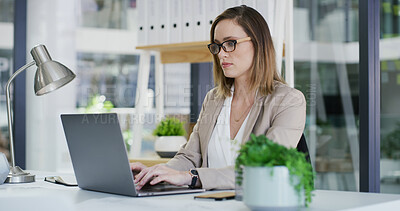 Buy stock photo Accounting, laptop and typing with business woman at desk in office for financial audit or review. Computer, bookkeeping and finance with accountant person in workplace for budget or revenue analysis