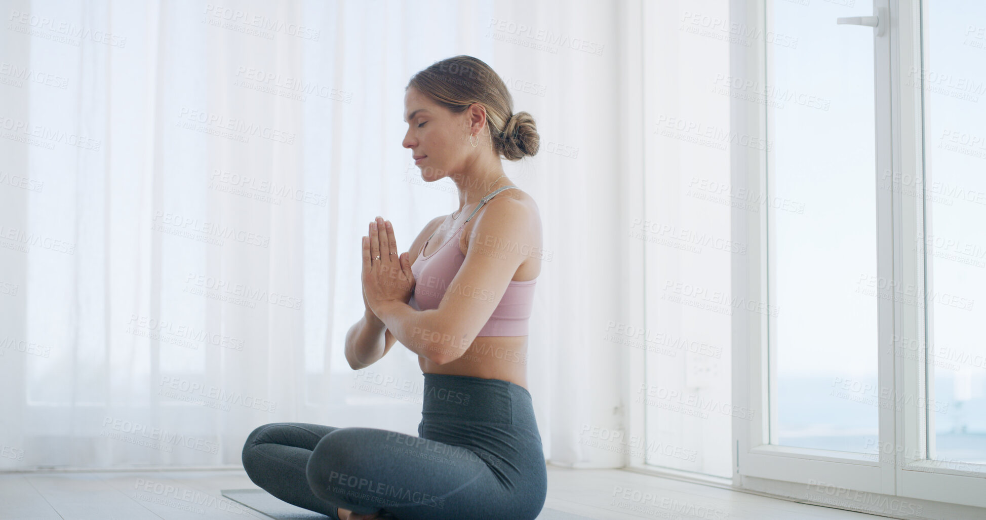 Buy stock photo Meditation, woman and prayer hands by window for namaste, mindfulness and zen for holistic healing. Calm, peace and person for spiritual wellness, awareness and self care for mental health in home