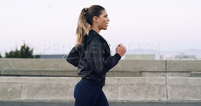 Buy stock photo Woman, running and exercise on bridge in city for training routine, challenge and outdoor on road. Person, fitness and cardio workout with profile in urban town, street and wellness in Colombia