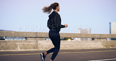 Buy stock photo Woman, running and exercise with back in city for training routine, challenge and outdoor on bridge. Person, fitness and workout in morning with cardio, wellness or health on urban road in Colombia