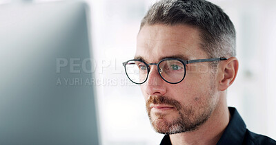 Buy stock photo Man, computer and thinking at office with review, proposal or spectacles for eyesight at startup company. Person, pc and reading glasses for vision, perspective and problem solving at creative agency