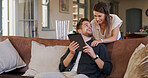 Talking, couple and people with tablet, house and planning for trip, together and bonding in lounge. Happy, man and chat with woman, smile and purchase of tickets or booking flight on web in home