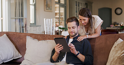 Buy stock photo Online shopping, couple and browsing with tablet, house and planning for trip, together and bonding. Home, man and happy with woman in lounge, smile and purchase of tickets or booking flight on web