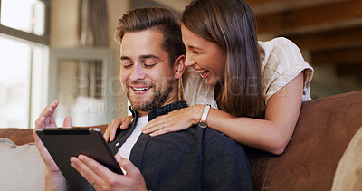 Buy stock photo Tablet, happy and couple on sofa in house with social media, networking or communication online. Smile, love and man with woman on digital technology for contact in living room together at apartment.