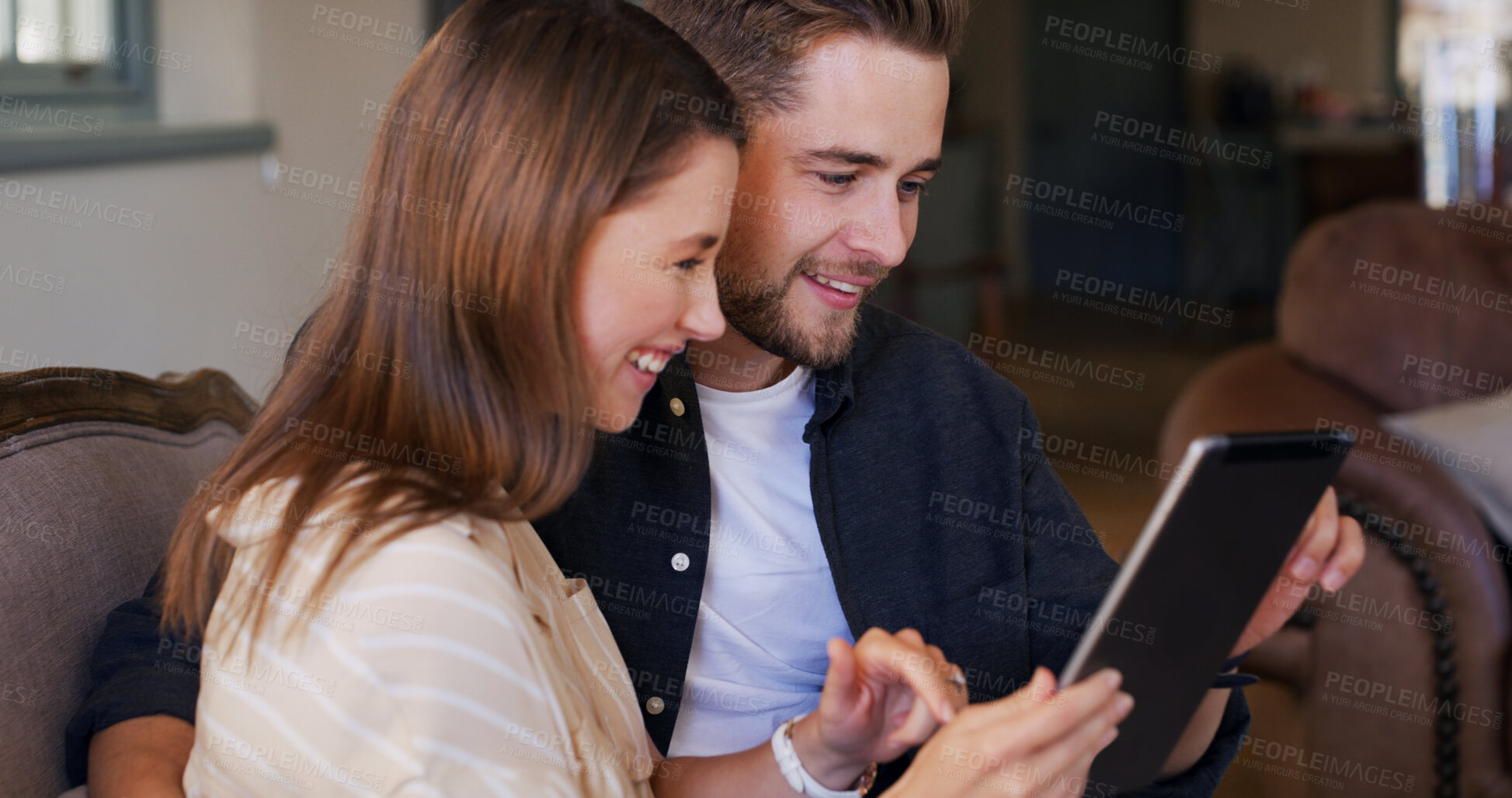 Buy stock photo Happy, couple and people with tablet, house and planning for trip, together and talk in living room. Bonding, man and chat with woman, smile and purchase of tickets or booking flight on web in home