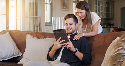 Buy stock photo Bonding, couple and people with tablet, house and planning for trip, together and talking in lounge. Happy, man and chat with woman, smile and purchase of tickets or booking flight on web in home