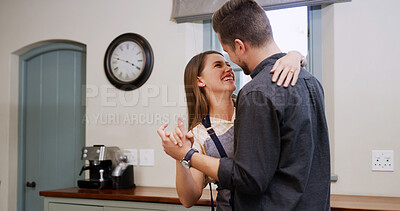 Buy stock photo Couple, dance and smile together in kitchen for celebration, bonding or enjoying music in home. Energy, dancer and love with people in apartment for support, connection and happiness in relationship