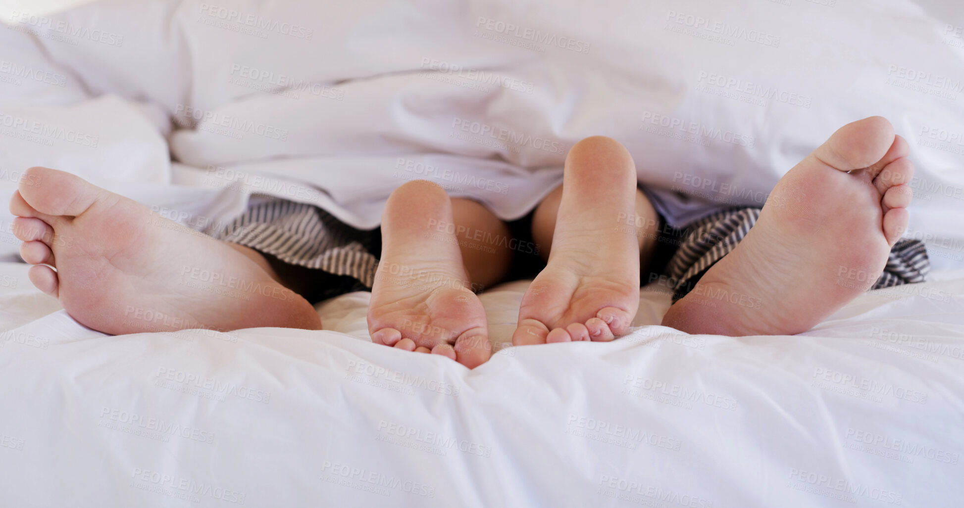 Buy stock photo Love, sleeping and feet of couple in bed for cuddle, marriage partner and relax together. Connection, romantic relationship and morning with man and woman in bedroom of home for dream and bonding