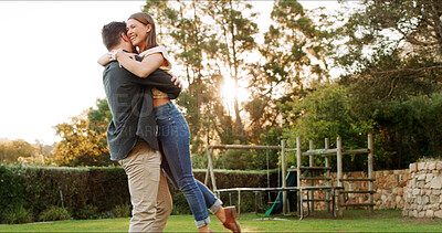 Buy stock photo Happy, couple and hug or lift in garden for trust, energy and love with care outdoor for romance. Marriage, support and excited for healthy relationship with man carrying woman for bonding in nature