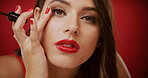 Woman, makeup brush and studio portrait for lashes, tools and check for beauty on red background. Girl, cosmetics product and application with mascara for transformation, glow and pride in France