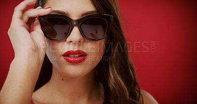Buy stock photo Beauty, sunglasses and portrait of woman in studio for fashion, trendy style and cosmetics. Space, aesthetic and face of confident person with accessories, makeup and red lipstick on color background