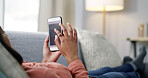 Woman, hands and research with phone screen on sofa for fitness website or health app in home. Female person, UI or user scrolling with mobile smartphone for online service, UX or wellness in house