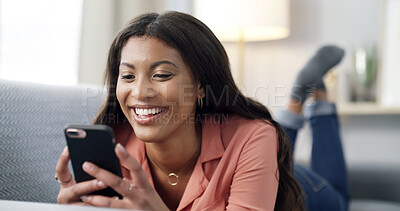 Buy stock photo Girl, phone and laugh for texting on couch, relax and contact on web chat for online dating at home. African woman, smartphone and laying with mobile app, meme or social network on sofa at apartment