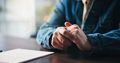 Buy stock photo Hands, person at desk and nervous with document for debt management application, worry or anxiety with bankruptcy. Financial crisis, mistake or concern with legal paperwork for finance resolution