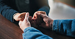 Holding hands, table and couple in home for support, empathy and bonding for love. Relationship, counseling and above of people together for connection, affection and care for commitment in house