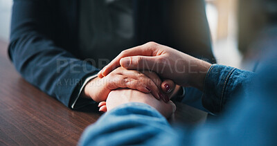 Buy stock photo Holding hands, table and couple in home for love, empathy and bonding for support. Relationship, counseling and above of people together for connection, affection and care for commitment in house