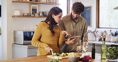 Buy stock photo Tablet, cooking and couple cut vegetables with help, online tutorial or meal prep. Tech, man and woman with chopping board for organic food guide, pepper or healthy recipe with wine in home kitchen