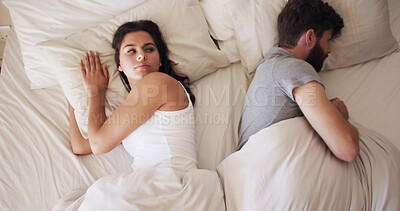 Buy stock photo Couple, fight and woman with man sleeping in bed, conflict or marriage issue with trouble or upset at home. Awake, above annoyed or angry person with husband in bedroom, frustrated or moody in house