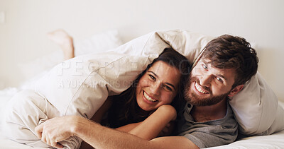 Buy stock photo Couple, portrait and cuddle in bed with happiness, moment and connection for bonding in home. Woman, man and under blanket for romance, smile and rest with commitment, trust and comfort in bedroom