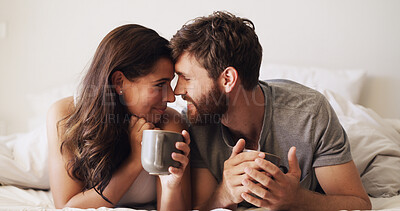 Buy stock photo Couple, forehead and coffee in bed with happiness, moment and connection for bonding in home. Woman, man and smile for romance, morning drink and rest with commitment, trust and comfort in bedroom