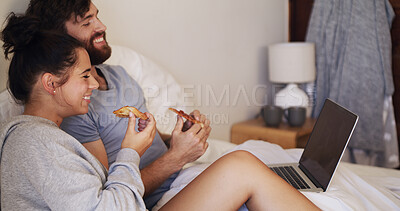 Buy stock photo Eating, laptop and couple with pizza on bed watching movie, series or show together on weekend. Happy, home and man with woman for enjoying takeout food with computer for streaming film in bedroom.