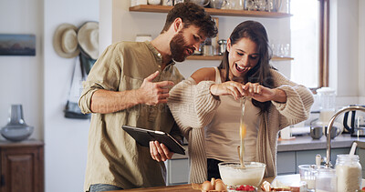 Buy stock photo Couple, tablet and baking in kitchen with egg, online tutorial and help with instructions for recipe. Home, man and woman cooking with technology for ingredients, food guide and laugh for meal prep