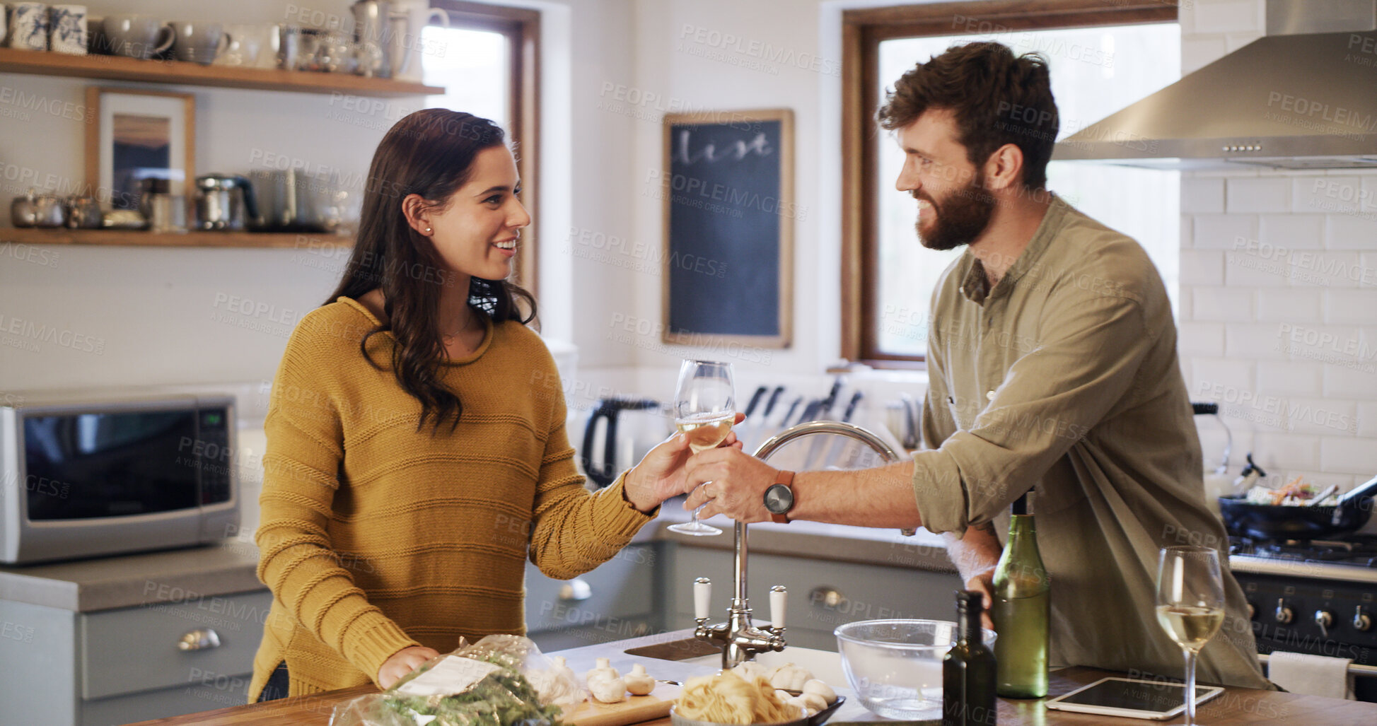 Buy stock photo Cooking, ingredients and wine with couple in kitchen of home together for meal preparation. Bonding, food and recipe with man and woman drinking in apartment for diet, healthy eating or nutrition