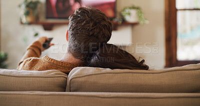 Buy stock photo Back, relax and television with couple on sofa in living room of home for video streaming. Entertainment, movie and watching tv with people in apartment together for bonding, subscription or wellness