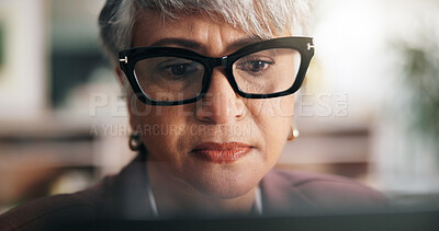 Buy stock photo Glasses, reading and business woman on computer for insurance policy, report or research. Tech, office and serious face of mature accountant with email for claims update, risk management or proposal
