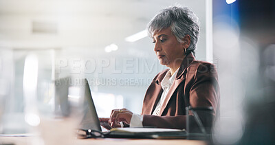 Buy stock photo Business, laptop and typing with mature woman in office for administration, planning or report. Computer, management and reading with employee in workplace for email feedback, research or review
