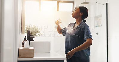 Buy stock photo Black woman, deodorant spray and morning in bathroom, grooming and hygiene for scent in home. African person, aerosol can and fresh fragrance with self care routine, product or perfume at apartment