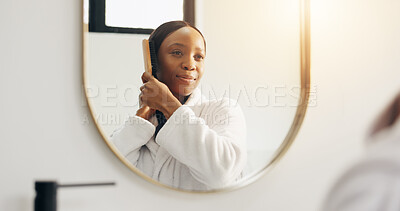Buy stock photo Mirror, bathroom and black woman with brush in morning for grooming, hygiene and routine in home. Happy, smile and person with hairbrush in reflection for beauty, self care and healthy texture