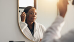 Home, face roller and black woman in bathroom, mirror and natural skincare with wellness. Reflection, jade cosmetic tools and African person with facial massage, dermatology and beauty with grooming