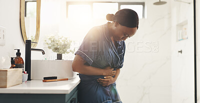 Buy stock photo Morning, pain and woman with stomach ache in home for menstruation, discomfort and PMS bloating. Cramps, black person and belly indigestion from ovulation cycle, IBS and abdominal problem in bathroom