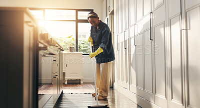 Buy stock photo Sweeping, home and black woman in kitchen, broom and spring cleaning with lens flare. African person, apartment and housekeeping to remove dust, bacteria and routine with safety, chores or prevention