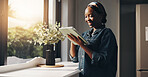 Happy, freelancer and black woman with tablet, home and research for article on social media or web. Online, writer and person with tech for story, scroll and creative for remote work, smile in house