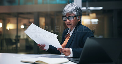 Buy stock photo Business, woman or serious with paperwork in office for financial review, invoices or compliance risk. Bookkeeper, mature person and laptop with statements for budget forecasting, payroll and night