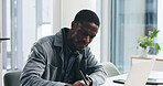 Black man, writing and office with laptop for business report, project planning or company research. Businessman, reading and taking notes with computer for schedule, agenda or tasks in workplace