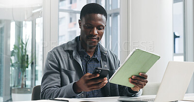 Buy stock photo Black man, phone and reading with technology for business report, project planning or company research. Businessman, tablet and review notes with computer for schedule, agenda or tasks in workplace